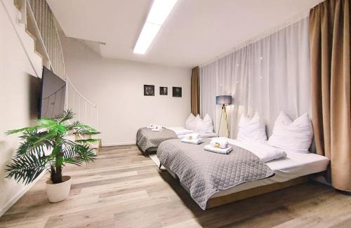 Mitte Apartment | Design-Apartmenthaus für bis zu 12, modern, Dachterrasse, Grill, ruhige Lage, Disney plus, Wii, LAN und WLAN