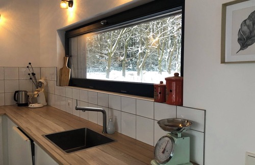 Breitscheid Villa | Design home with large fenced natural garden & fireplace