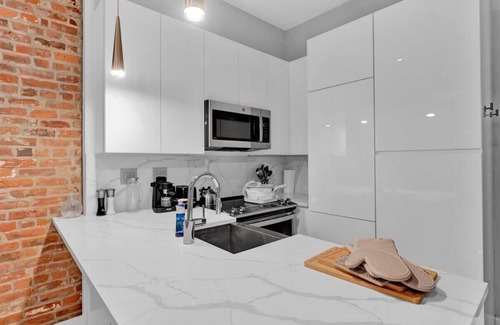 West Village Apartment | Designer 1BR W Private Garden Plus Hot Tub