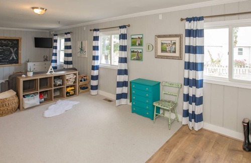 Sandbridge House | Designer beach house with incomparable bay views, foosball table, dock, AC