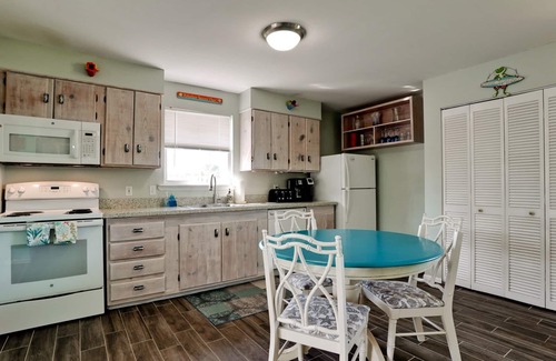 Anna Maria House | Desirable North-End Gem on Canal with Dock, Heated Pool. Clean and Spacious.