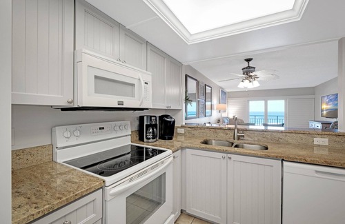 New Smyrna Beach Condo | Direct oceanfront condo with private balcony, heated beachfront pool, and beach access