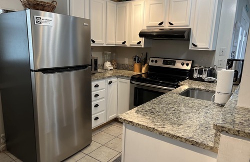 Rehoboth by the Sea Condo | Dog-Friendly 2-floor Dewey Beach condo, steps away from beach, sleeps 10