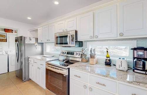Plantation House | Dog-friendly beachfront home with private pool, on-site pool, gym, & central AC