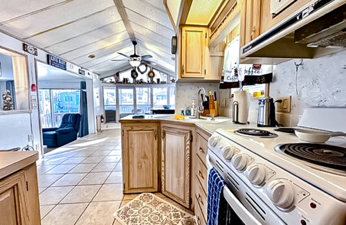 Port Isabel House | Dog-friendly bayfront home with in/outdoor pools, tennis, gym, W/D, bay views