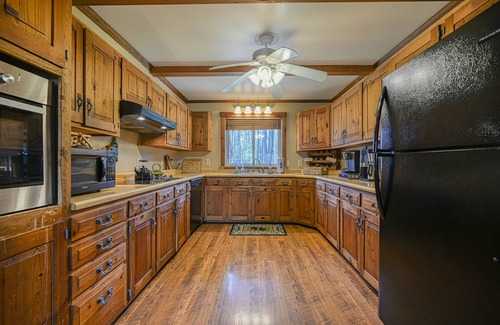 Accident House | Dog-friendly cabin with firepit, deck, private hot tub, fireplace