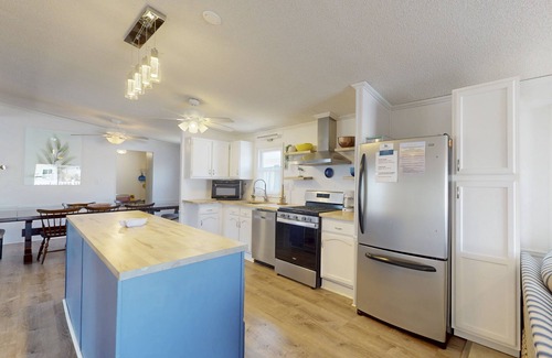Montego Bay House | Dog-friendly, canal-front home with community pool & tennis, dock, & WiFi