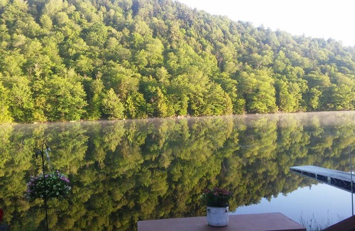 Piseco House | Dog friendly, fenced yard, sitting on the shore of Oxbow Lake