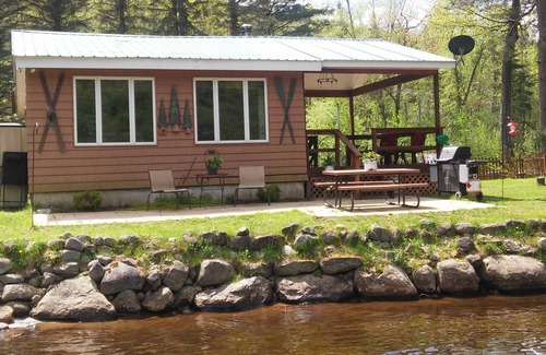 Piseco House | Dog friendly, fenced yard, sitting on the shore of Oxbow Lake