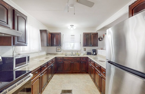 Eastpoint House | Dog friendly home overlooking the Gulf with classic veranda, yard & sunrise view