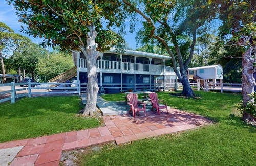 Eastpoint House | Dog friendly home overlooking the Gulf with classic veranda, yard & sunrise view
