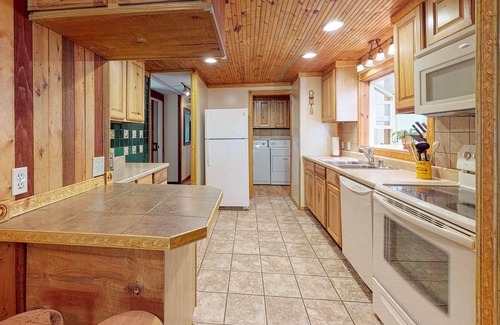 Covington House | Dog-friendly house & studio w/ a deck, private hot tub, firepit, & large yard