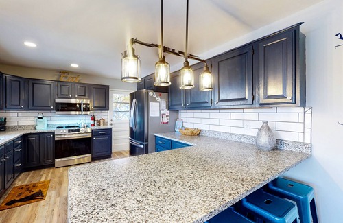 Huddleston House | Dog-friendly lakefront home with hot tub, dock, kayaks, & game room