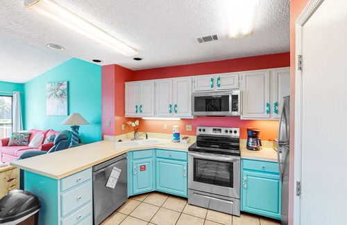 East End House | Dog-friendly, poolside townhouse w/community pool, grills, deck, beach gear, AC