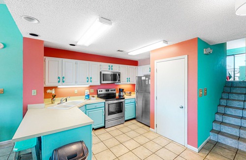 East End House | Dog-friendly, poolside townhouse w/community pool, grills, deck, beach gear, AC