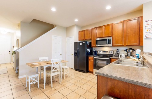 Crestwynd Bay House | Dog-friendly townhouse near Disney with outdoor pool, patio, streaming, W/D, AC