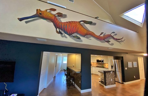 Cocoa House | Dome home full of murals and a gameroom.