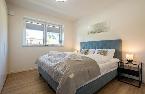 Dorumer Neufeld Apartment | Dorumer Seestern - Ferienwohnung mit Terrasse und Sauna