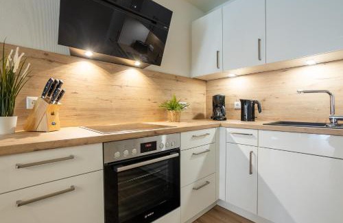 Dorumer Neufeld Apartment | Dorumer Seestern - Ferienwohnung mit Terrasse und Sauna