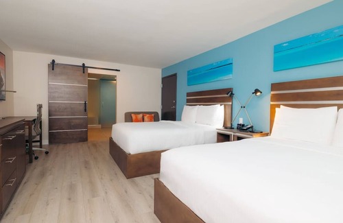 Harbor Hotel | Double Queen Comfort | Lounge, Heated Pool & Long Beach Dining Nearby
