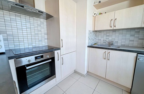 Granville Apartment | Downtown Granville: 2-Bedroom Apartment with Parking, Elevator, 300m to Beach