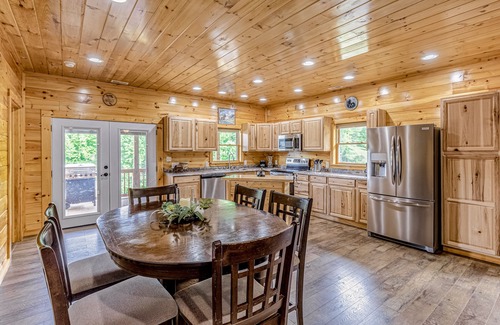 Bryson City House | Dreamy dog-friendly log cabin with free WiFi, covered deck, foosball, & A/C