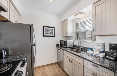 Port Aransas Condo | Drink your morning coffee on the deck watching the ships pass by.