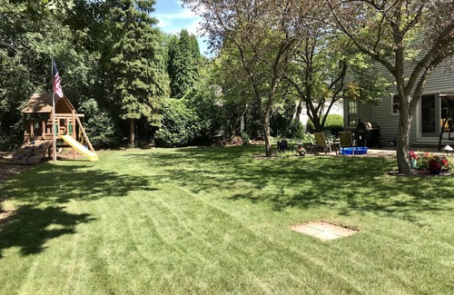 Oshkosh House | EAA Home - Quiet & Convenient - 2.7mi to EAA w/wooded backyard