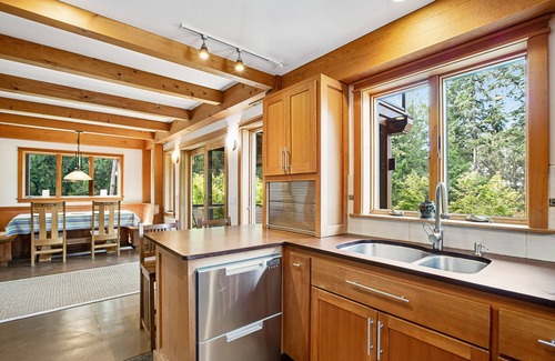 Bainbridge Island House | Eco-conscious home with private hot tub, Olympic views, gym, & play structure