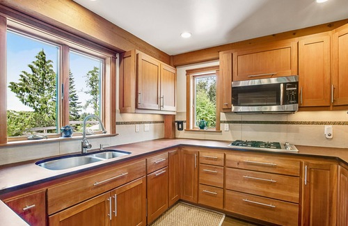 Bainbridge Island House | Eco-conscious home with private hot tub, Olympic views, gym, & play structure