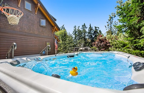 Bainbridge Island House | Eco-conscious home with private hot tub, Olympic views, gym, & play structure