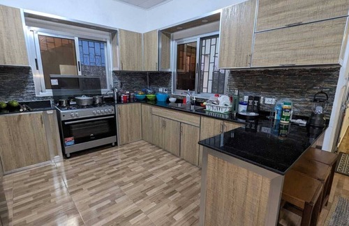 Marshall House | Eco-friendly sustainable family sized spacious home in quiet neighborhood.
