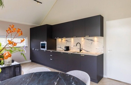 Oirschot House | Eco Villa in Latour by Scenic Pond