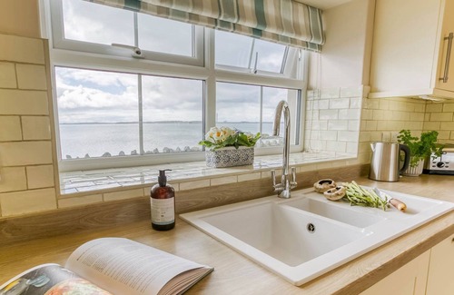 Holyhead Cottage | Efail Penrhyn - an on the beach that sleeps 6 guests in 3 bedrooms