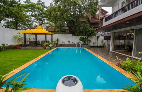Kune N.m. Villa | EL Lodge by StayVista - Pool, lawn, and a charming gazebo for your perfect getaway
