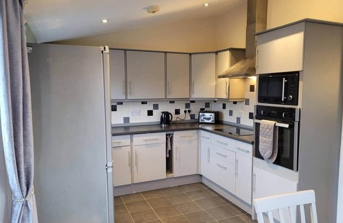 Low Catton House | Elckys stunning HOT TUB lodge York with secure garden and kids play area
