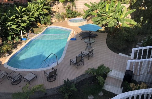 Tower Isle House | Elegant Estate Home nOcean/view . balconies nGarden/pool view nlush greenery nn