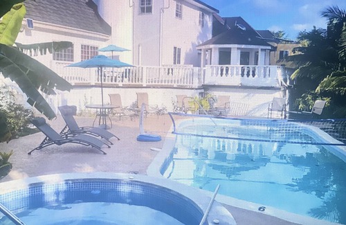 Tower Isle House | Elegant Estate Home nOcean/view . balconies nGarden/pool view nlush greenery nn