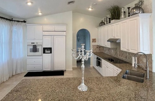 Coral Springs House | Elegant home private pool private patio bar with TV on lake