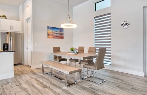 Pelican House | Elegant Modern Home on Salt Water Canal w/Heated Pool