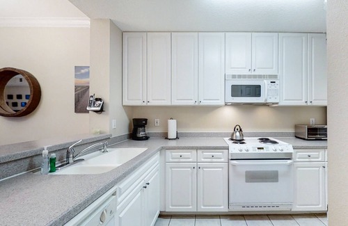 Amelia City Condo | Elegant, oceanfront condo with balcony, washer/dryer & on-site pool