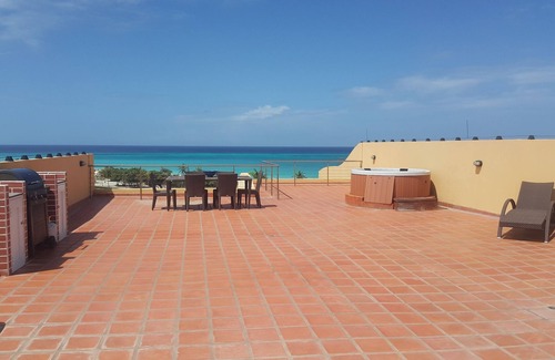 Oranjestad-West Condo | ELEGANT PENTHOUSE w- PRIVATE ROOFTOP TERRACE ON EAGLE BEACH!