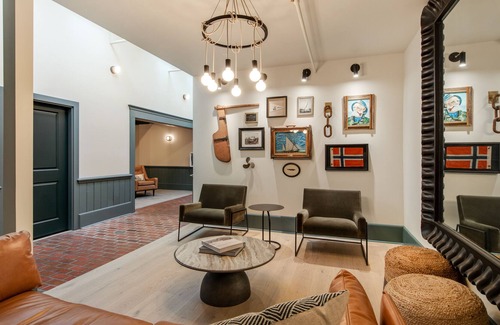 Poulsbo Apartment | Elegant room at Historic Hotel Scandi with sofabed, kitchenette, & city views