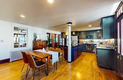 Belfast House | Elegant Victorian Gothic Revival home with wet bar, sunroom, & washer/dryer