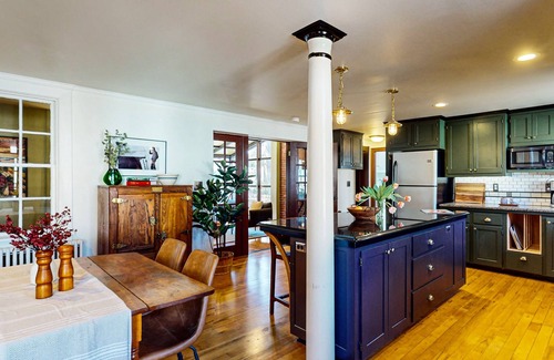 Belfast House | Elegant Victorian Gothic Revival home with wet bar, sunroom, & washer/dryer