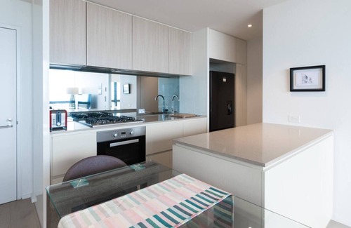 Docklands Apartment | Elevated Waterfront Stay with Indoor Pool and Views