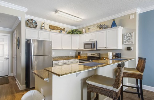 West Panama City Beach Condo | Emerald Isle 1305 - Front row beach chair service included! Affordable rates!