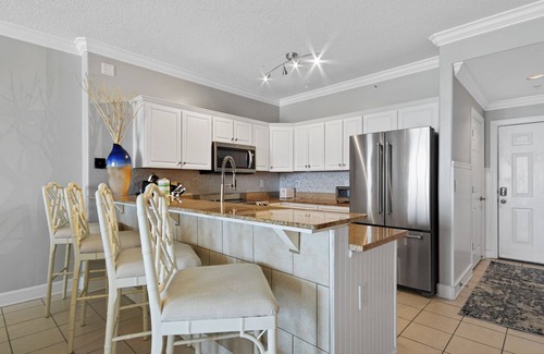 West Panama City Beach Condo | Emerald Isle 502 - Front row beach chair service included! Affordable rates!