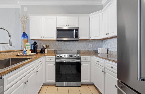 West Panama City Beach Condo | Emerald Isle 502 - Front row beach chair service included! Affordable rates!