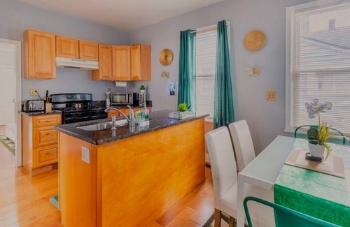 Tremont House | Emerald Oasis: Stylish Tremont 2BR Lower Unit by Christmas Story House | Parking 7 Min to Downtown